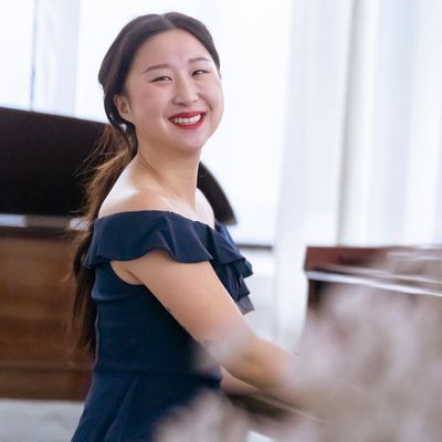 Portrait of Olesya Verbova, the practice guide, smiling warmly.